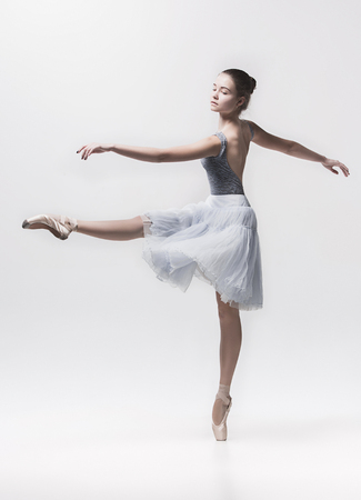 Young classical dancer isolated on white background.