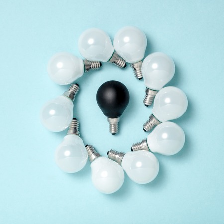 One light bulb outstanding,glowing different.business creativity idea concepts.flat lay designの写真素材