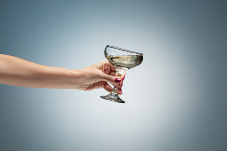hand holding glass of wineの写真素材