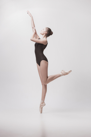 Young classical dancer isolated on white background.の写真素材