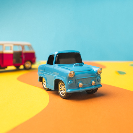 Vintage miniature car and bus in trendy color, travel conceptの写真素材