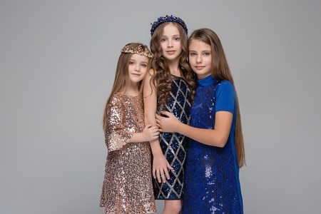 Studio portrait of young attractive caucasian teen girls posing at studioの写真素材