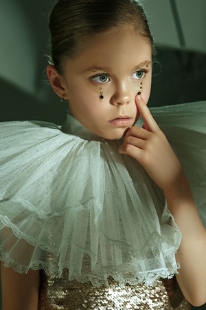 The fashion portrait of young beautiful teen girl at studioの写真素材