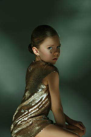 The fashion portrait of young beautiful teen girl at studioの写真素材