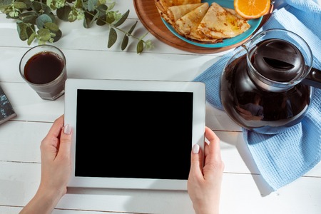 The female hands and pancakes with juice. Healthy breakfastの写真素材