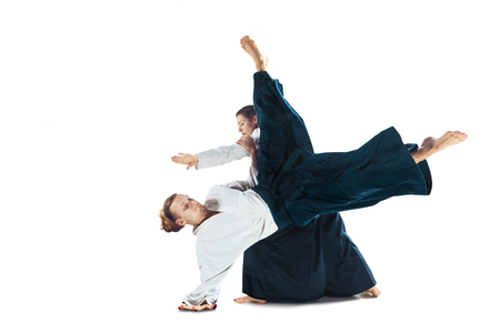 Man and woman fighting at Aikido training in martial arts schoolの写真素材