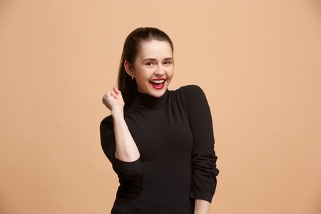 Winning success woman happy ecstatic celebrating being a winner. Dynamic energetic image of female...