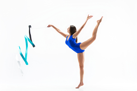 The portrait of beautiful woman gymnast on whiteの写真素材