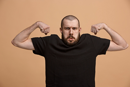 Strong businessman concept. Business man showing muscular handsの写真素材