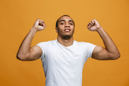 Winning success man happy ecstatic celebrating being a winner. Dynamic energetic image of male modelの写真素材