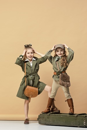 Two beautiful girls on a pastel backgroundの写真素材