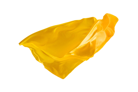 Smooth elegant transparent yellow cloth separated on white background.の写真素材