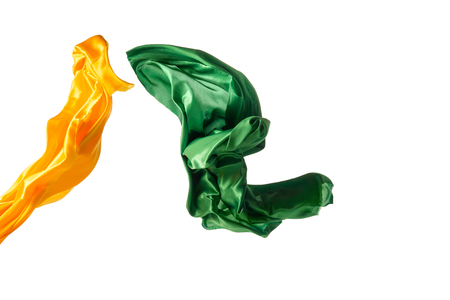 Smooth elegant transparent yellow, green cloth separated on white background.の写真素材