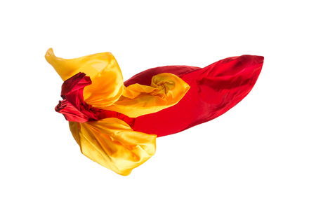 Smooth elegant transparent yellow, red, cloth separated on white background.の写真素材