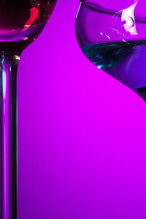 Two wine glasses standing on the table at studioの写真素材