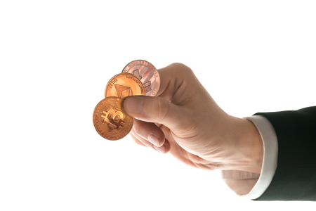 Male hand with golden bitcoin on white backgroundの写真素材