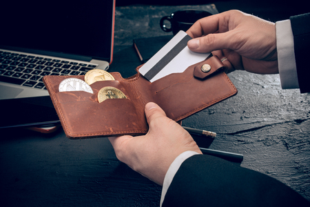 The golden bitcoin in mail hands