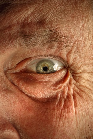 Close-up view on the eye of senior man.の写真素材