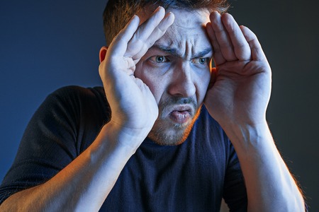 Sports, emotions and fan people concept - sad man watching sports on tv and supporting team at home