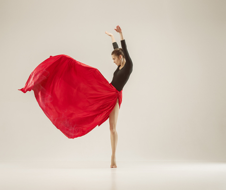 Modern ballet dancer dancing in full body on white studio background.の写真素材