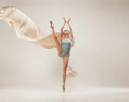 Modern ballet dancer dancing in full body on white studio background.の写真素材
