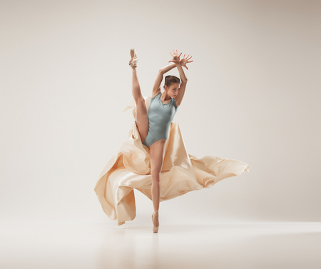 Modern ballet dancer dancing in full body on white studio background.の写真素材