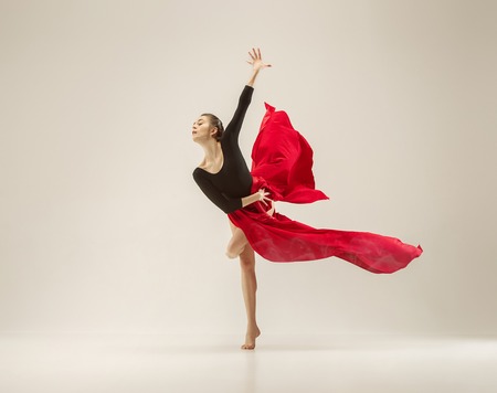 Modern ballet dancer dancing in full body on white studio background.の写真素材