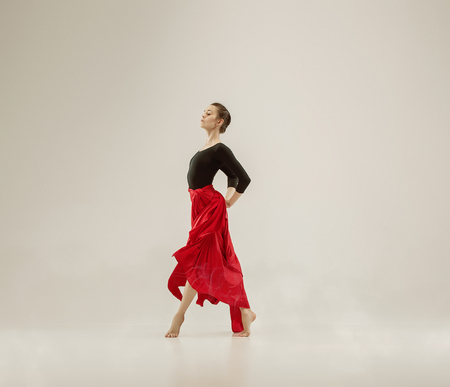 Modern ballet dancer dancing in full body on white studio background.の写真素材