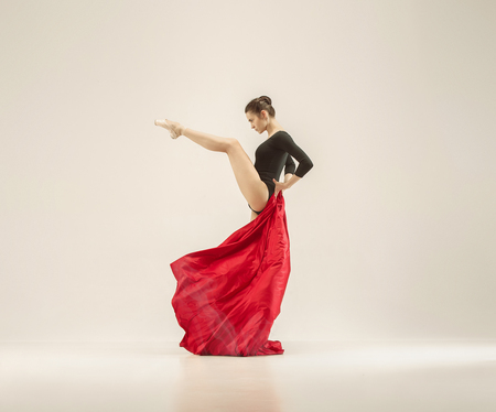 Modern ballet dancer dancing in full body on white studio background.の写真素材