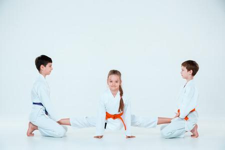 The group of boys and girl at Aikido training in martial arts school. Healthy lifestyle and sports conceptの写真素材