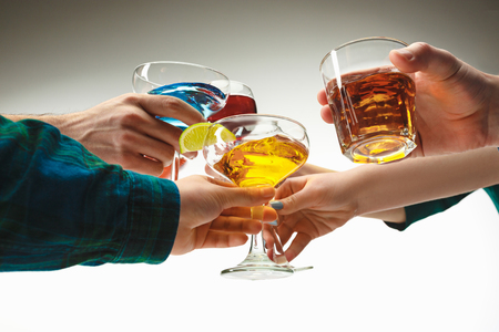 The male and female hands with exotic cocktailsの写真素材