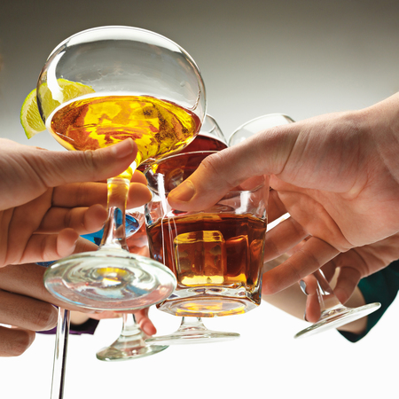 The male and female hands with exotic cocktailsの写真素材