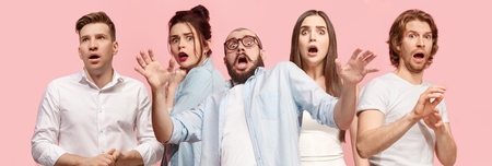 Portrait of the scared women and men on pink