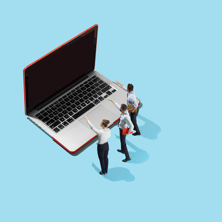 Flat isometric view of businessmen and woman showing at laptop with empty screen.の写真素材
