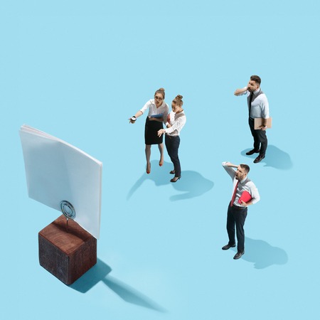 businessmen and woman are afraid of the symbol deadlineの写真素材