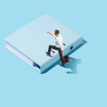 Flat isometric view of businessman going at folder with documents with empty copy spaceの写真素材