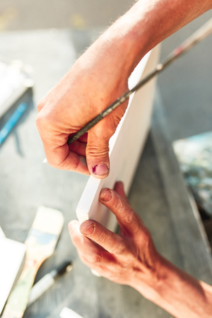 Close up man working of Architect sketching a construction project on his plane project at site construction workの写真素材