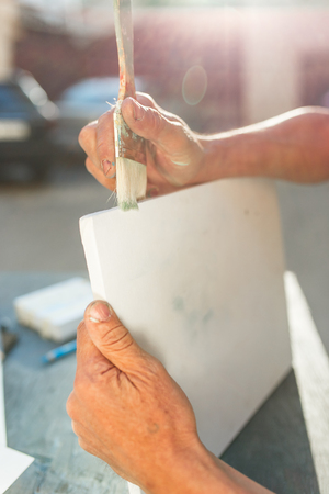 Close up man working of Architect sketching a construction project on his plane project at site construction workの写真素材