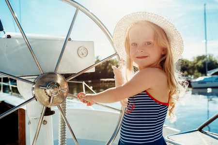 The children on board of sea yachtの写真素材