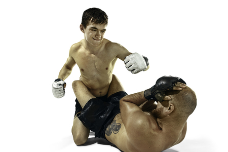 Two professional boxer boxing isolated on white studio backgroundの写真素材