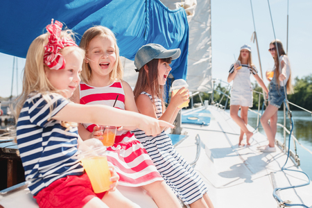 The children on board of sea yachtの写真素材