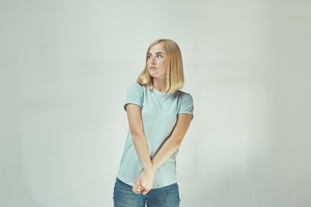 Beautiful woman looking suprised and bewilderedの写真素材