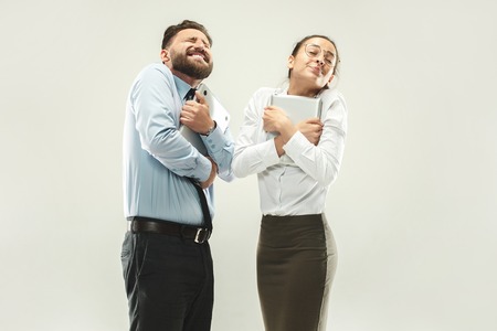 Winning success woman and man happy ecstatic celebrating being a winner.の写真素材
