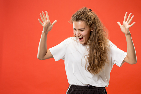 Winning success woman happy ecstatic celebrating being a winner. Dynamic energetic image of female modelの写真素材