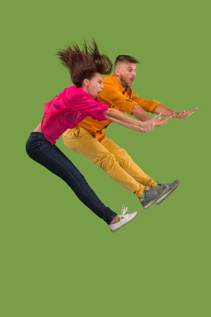 No. Freedom in moving and forward motion. The young couple jumping and rejecting something against...