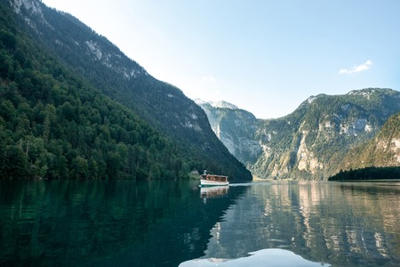 Stunning deep green waters of Konigssee, known as Germanys deepest and cleanest lake, located in the extreme southeast Berchtesgadener Land district of Bavaria, near the Austrian border.の写真素材