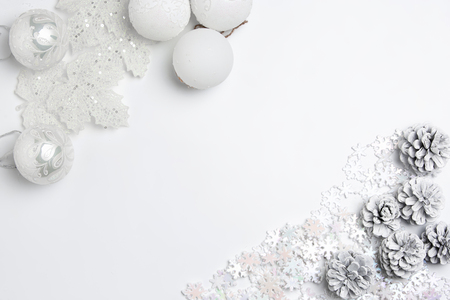 Christmas decorative composition of toys on a white tableの写真素材