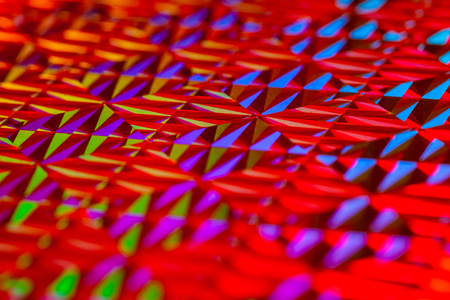 Texture of colored foil with holographic effect. Christmas, New Year, holiday, festival, carnival backgroundの写真素材