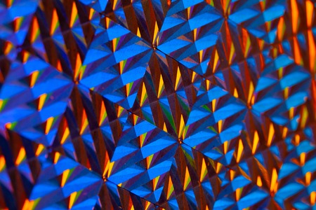 Texture of colored foil with holographic effect. Christmas, New Year, holiday, festival, carnival backgroundの写真素材