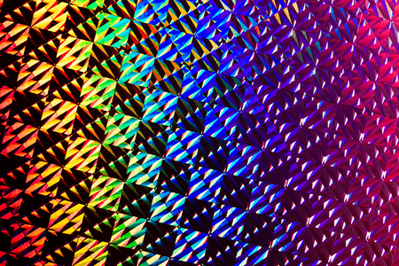 Texture of colored foil with holographic effect. Christmas, New Year, holiday, festival, carnival backgroundの写真素材